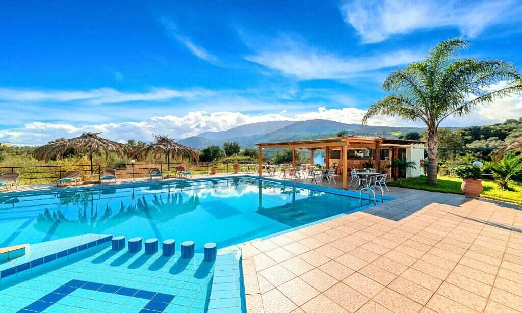 Outdoor swimming pool with mountain view at Welcome Apts