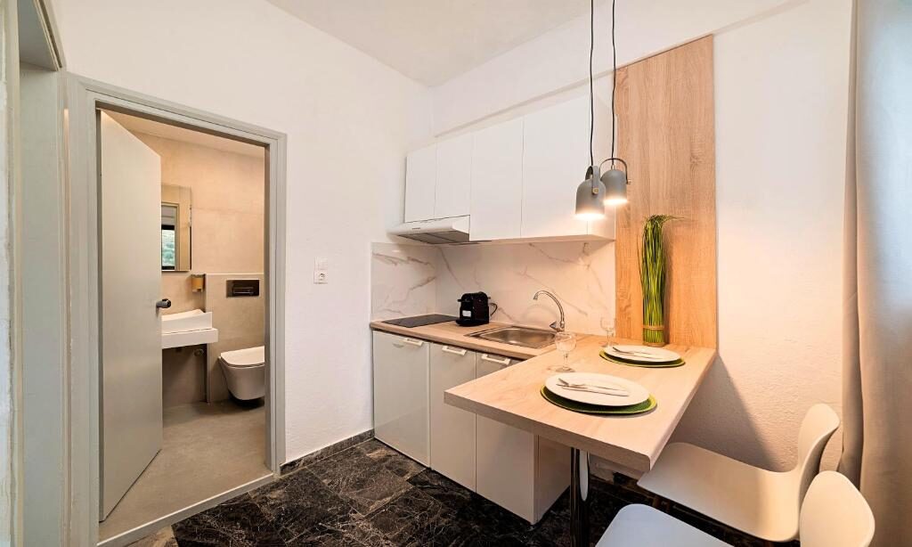 Kitchenette in an apartment at Welcome Apts